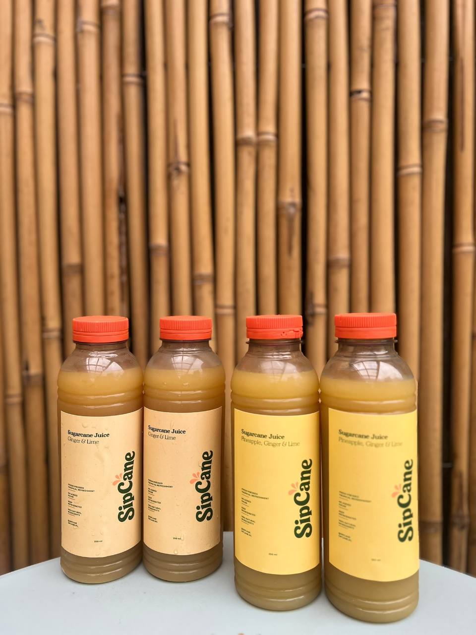 Four bottled SipCane drinks ready to serve