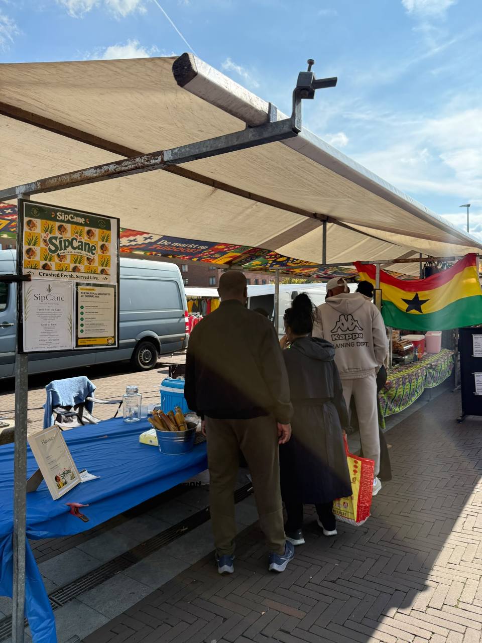 Customers visiting the SipCane stall at the Amsterdam market