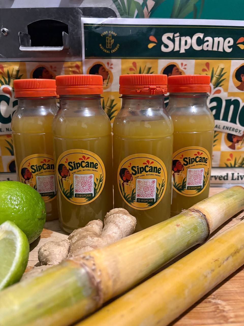 SipCane bottles with fresh sugarcane, lime and ginger