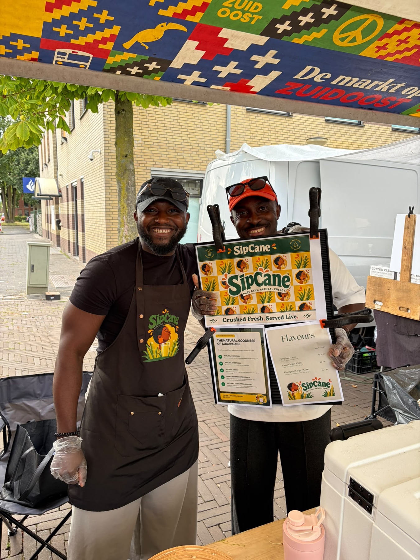 SipCane founders smiling after selling out at the first market